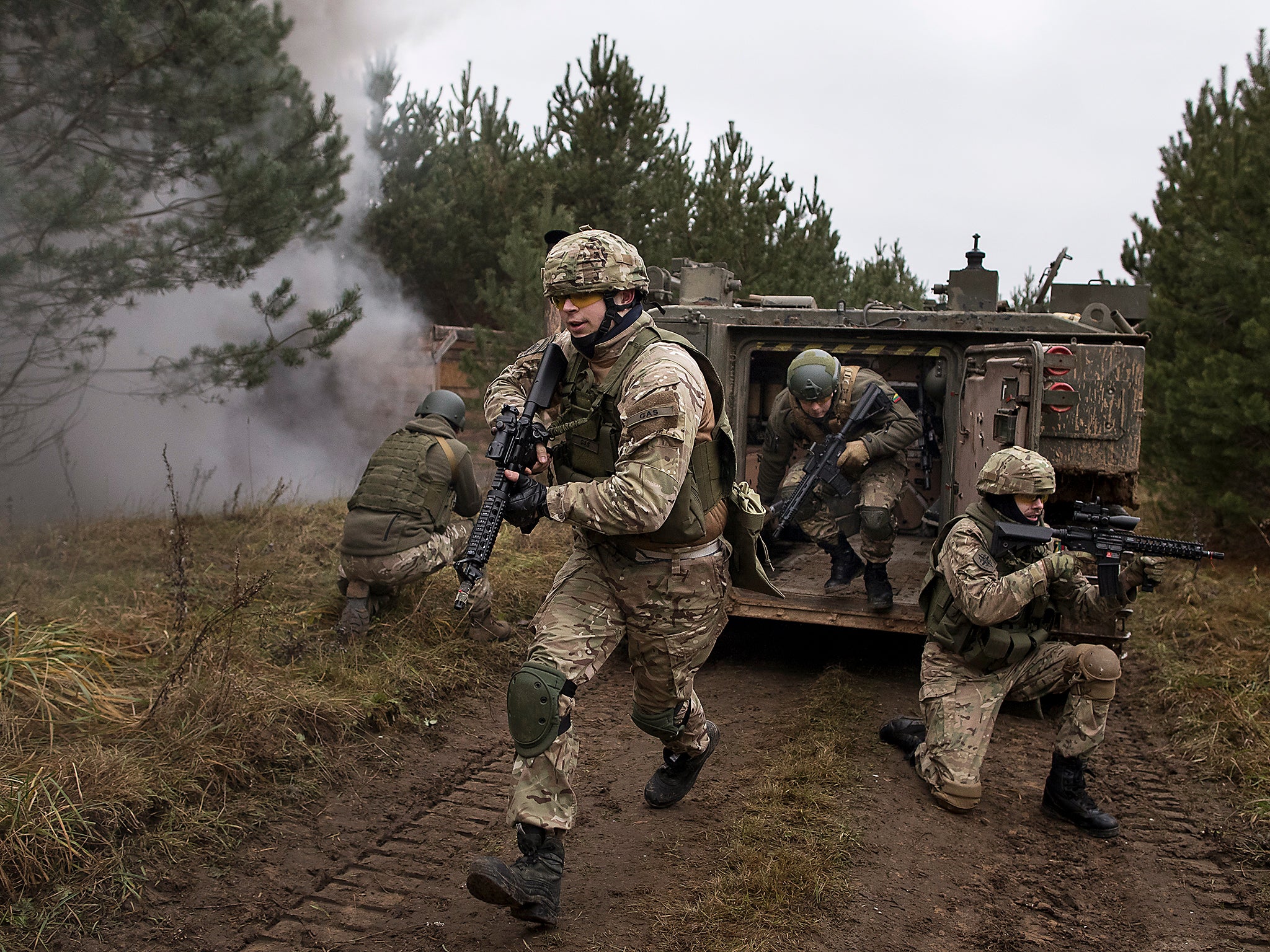 Young Lithuanian civilians in military fatigues practice insurgency tactics that they fear could be needed given Russia's resurgence, in the village of Pomarazai, some 25 km (15 miles) from the capital Vilnius, Lithuania