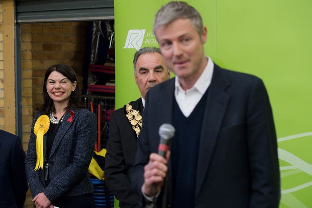 Newly elected Liberal Democrat MP Sarah Olney (L) listens to Zac Goldsmith (R) after she won his Richmond Park seat, 2 December, 2016