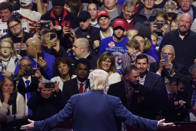 President-elect Donald Trump greets the audience during the USA Thank You Tour at the US Bank Arena in Cincinnati, Ohio