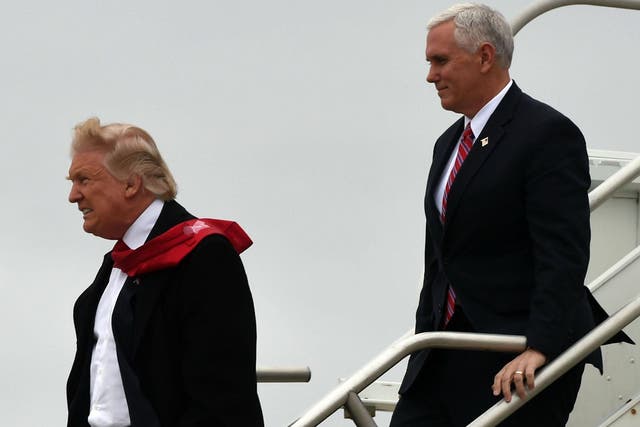 President-elect Donald Trump and Vice President-elect Mike Pence arrive on December 1, 2016 at the airport before they go on to visit the Carrier air conditioning and heating company in Indianapolis, Indiana