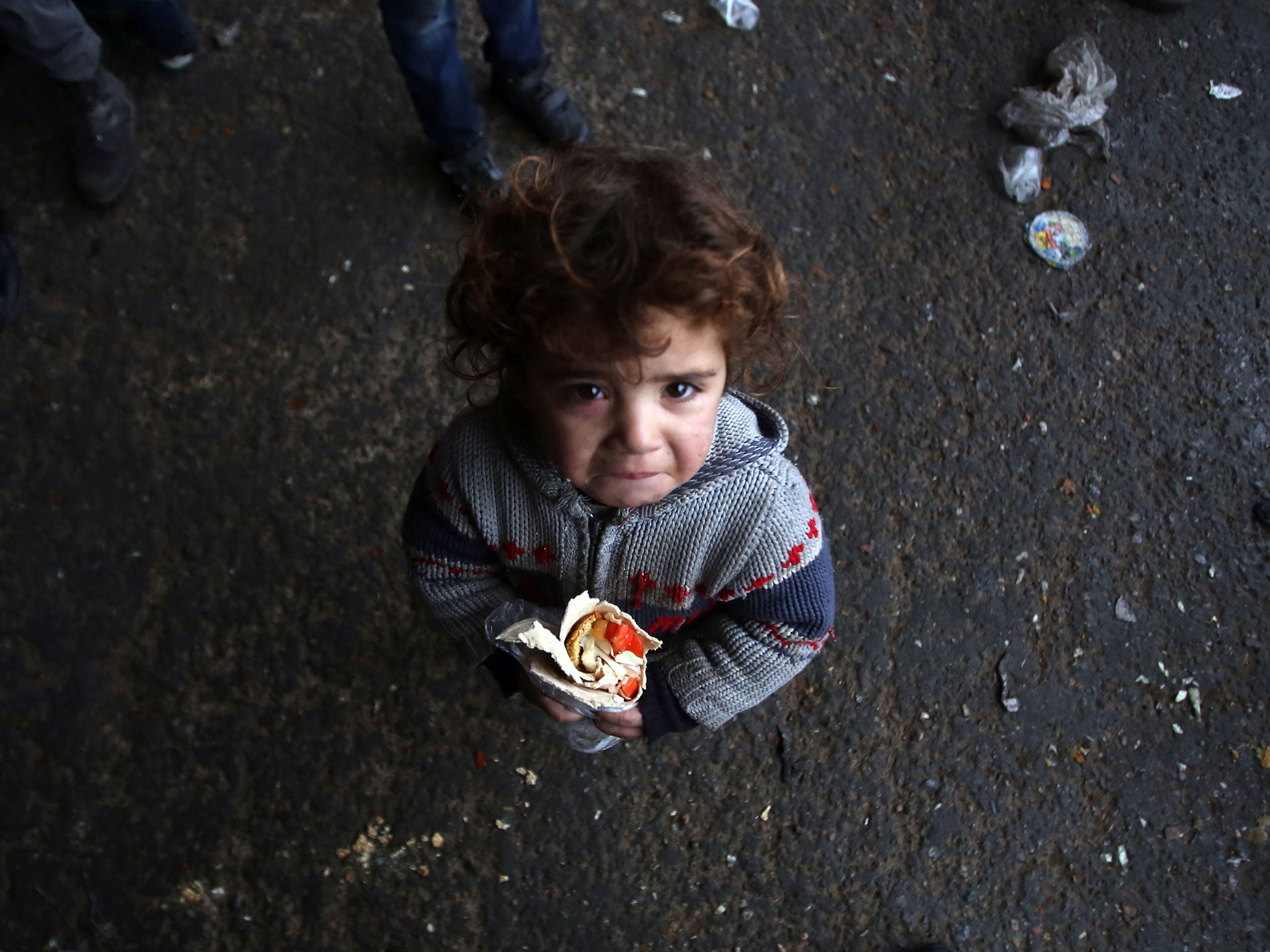 &#13;
Syrian children, such as this one at a shelter in Jibrin, face severe dangers &#13;