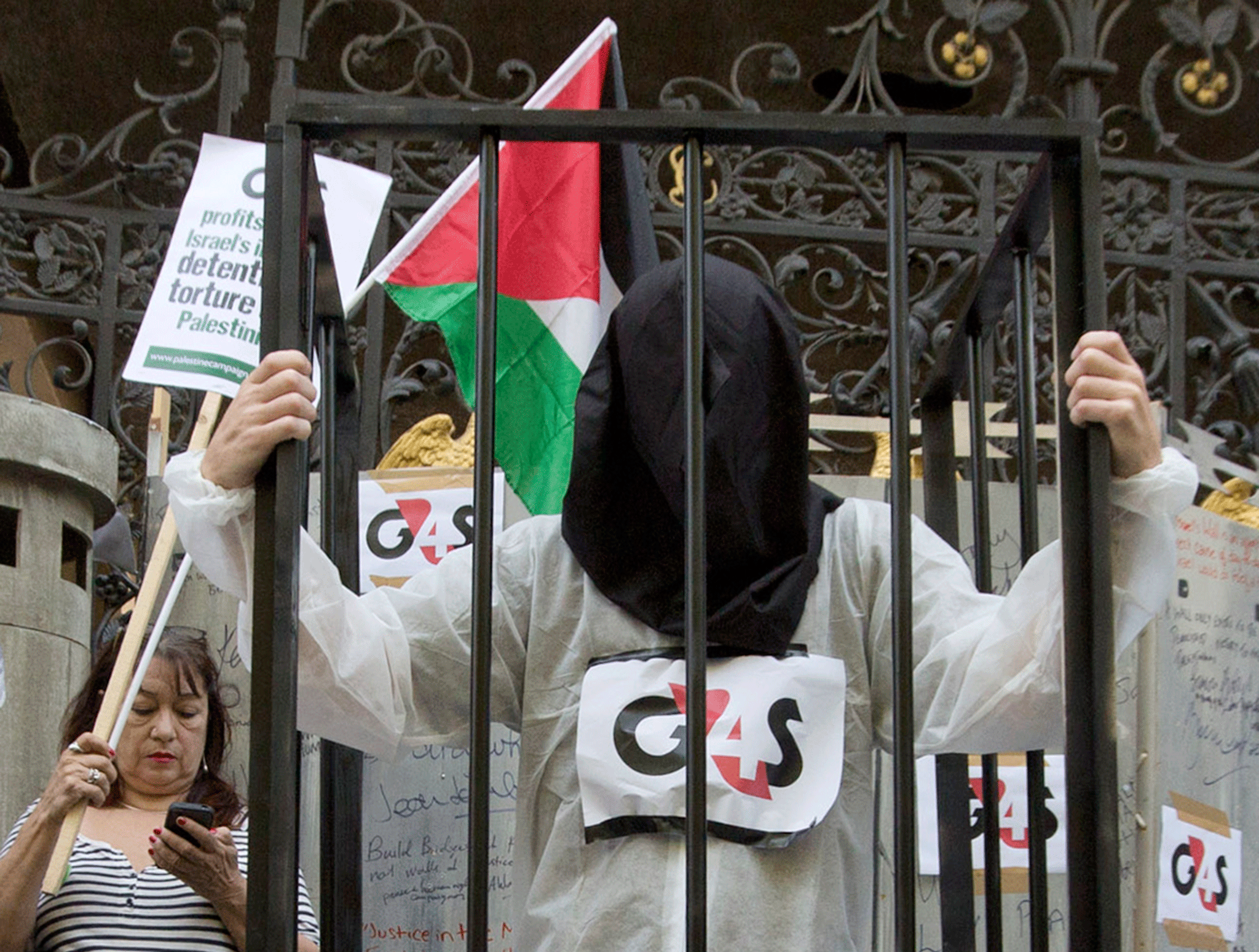 Human rights protesters at G4S' annual general meeting - the company denies campaigns influenced its decision