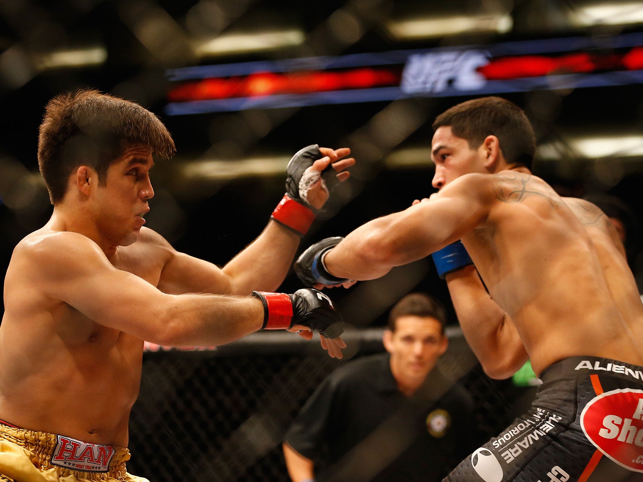 Henry Cejudo in action against Dustin Kimura