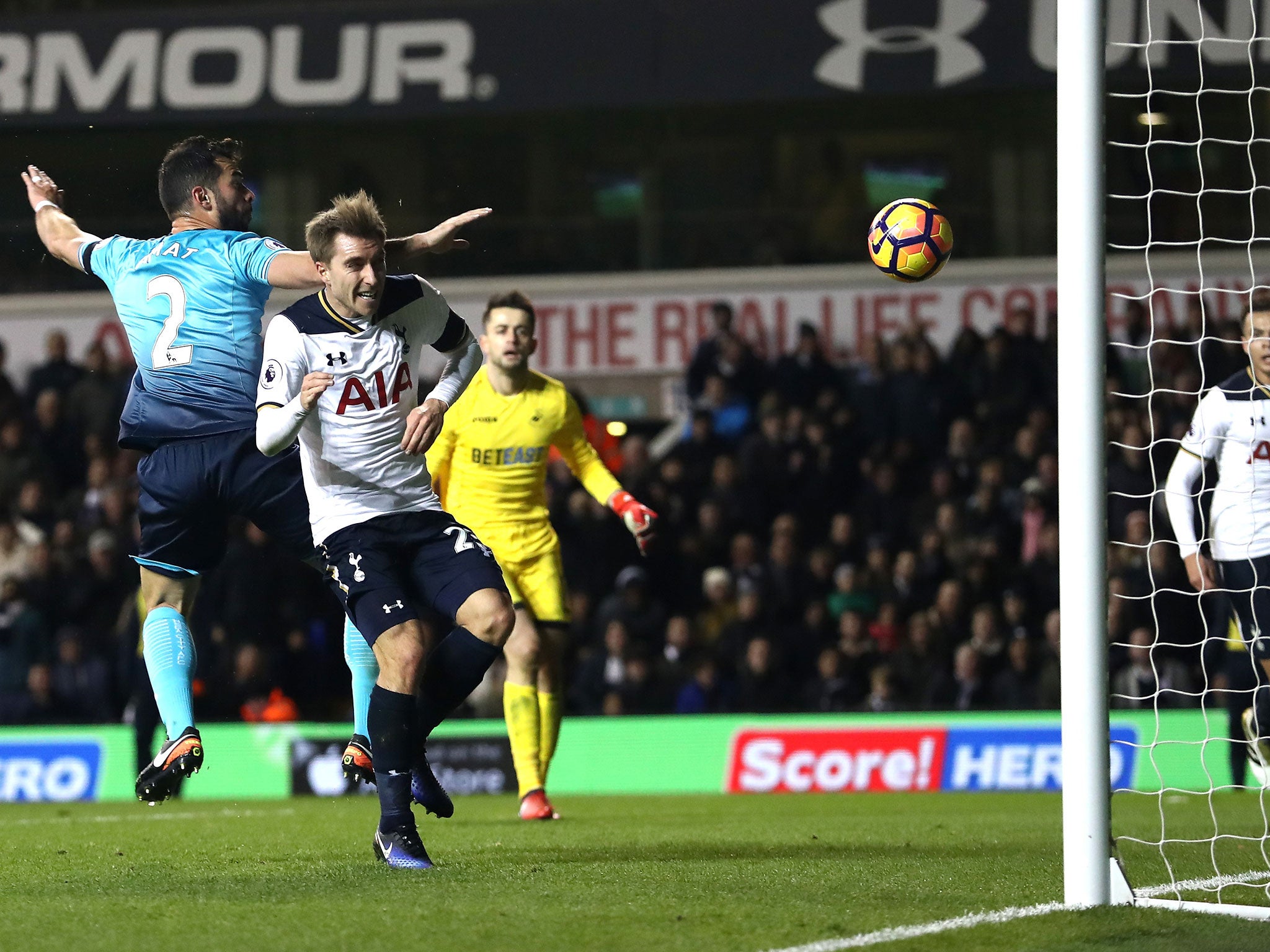 Christian Eriksen scores his team's fourth goal during