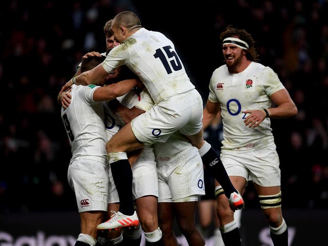 England's players celebrate with Ben Youngs after scoring his side's third try against Australia