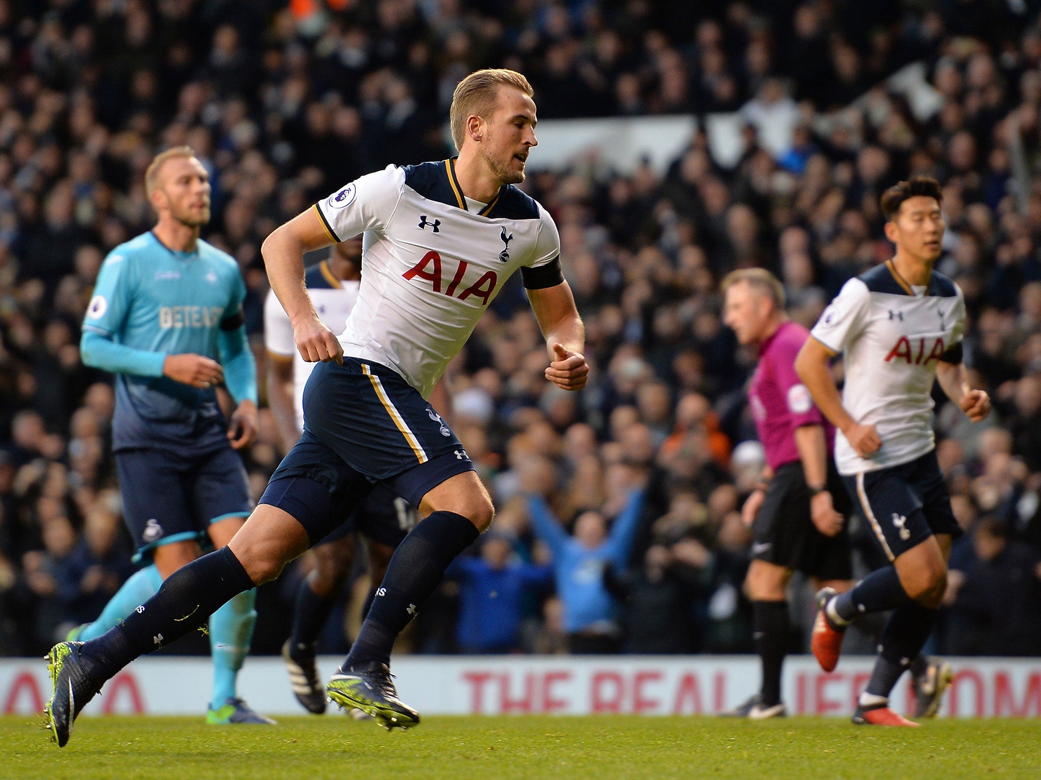 Harry Kane wheels away to celebrate after converting from the penalty spot