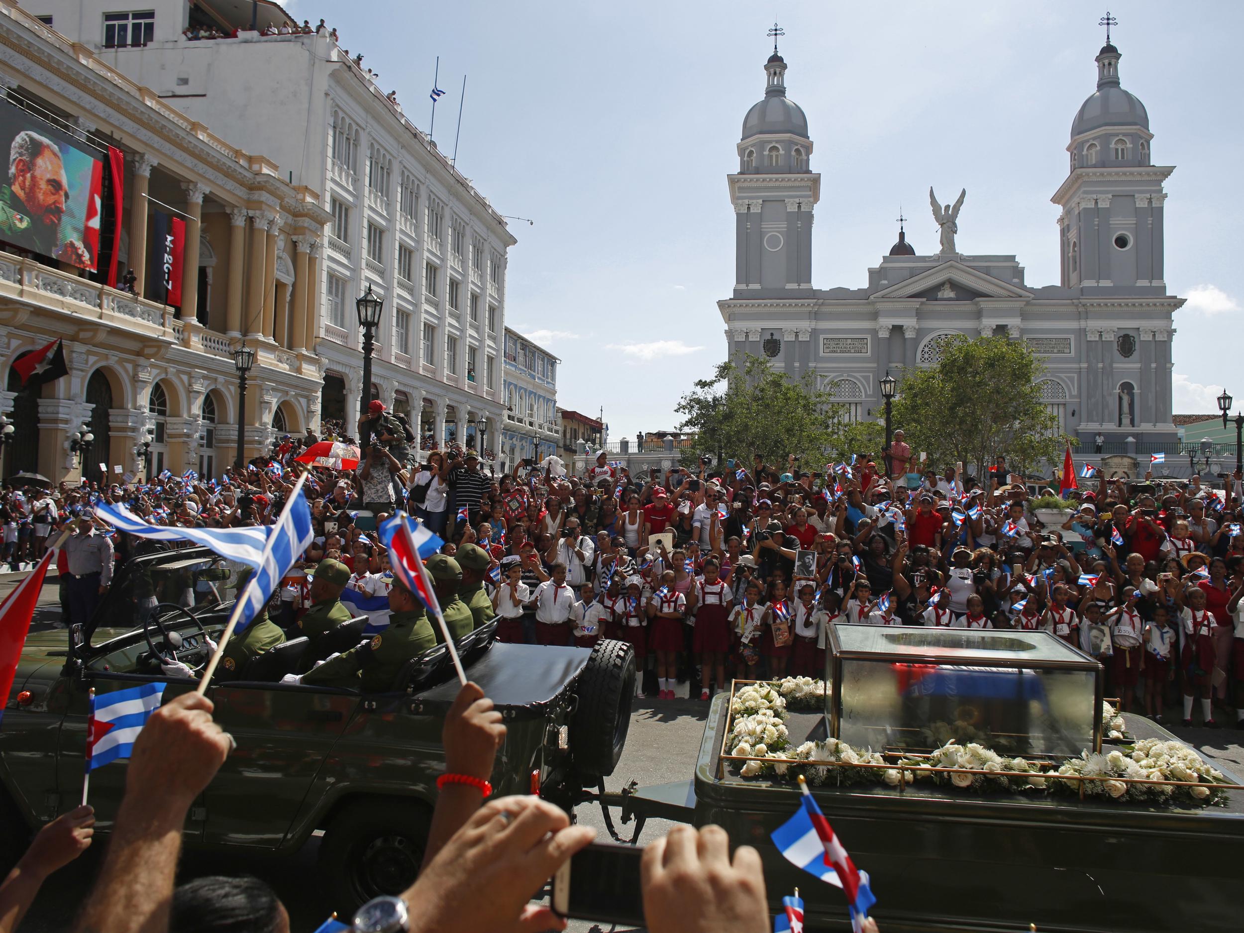 The motorcade carrying the ashes of the late Cuban leader Fidel Castro leaves Cespedes park in Santiago