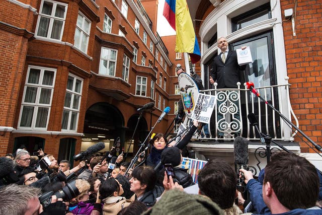 Julian Assange addresses the media from the balcony of Ecuador's UK embassy
