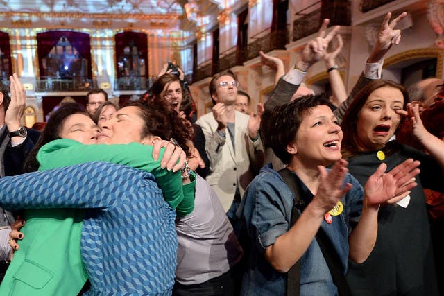 Austrians celebrate the eventual result of the presidential election