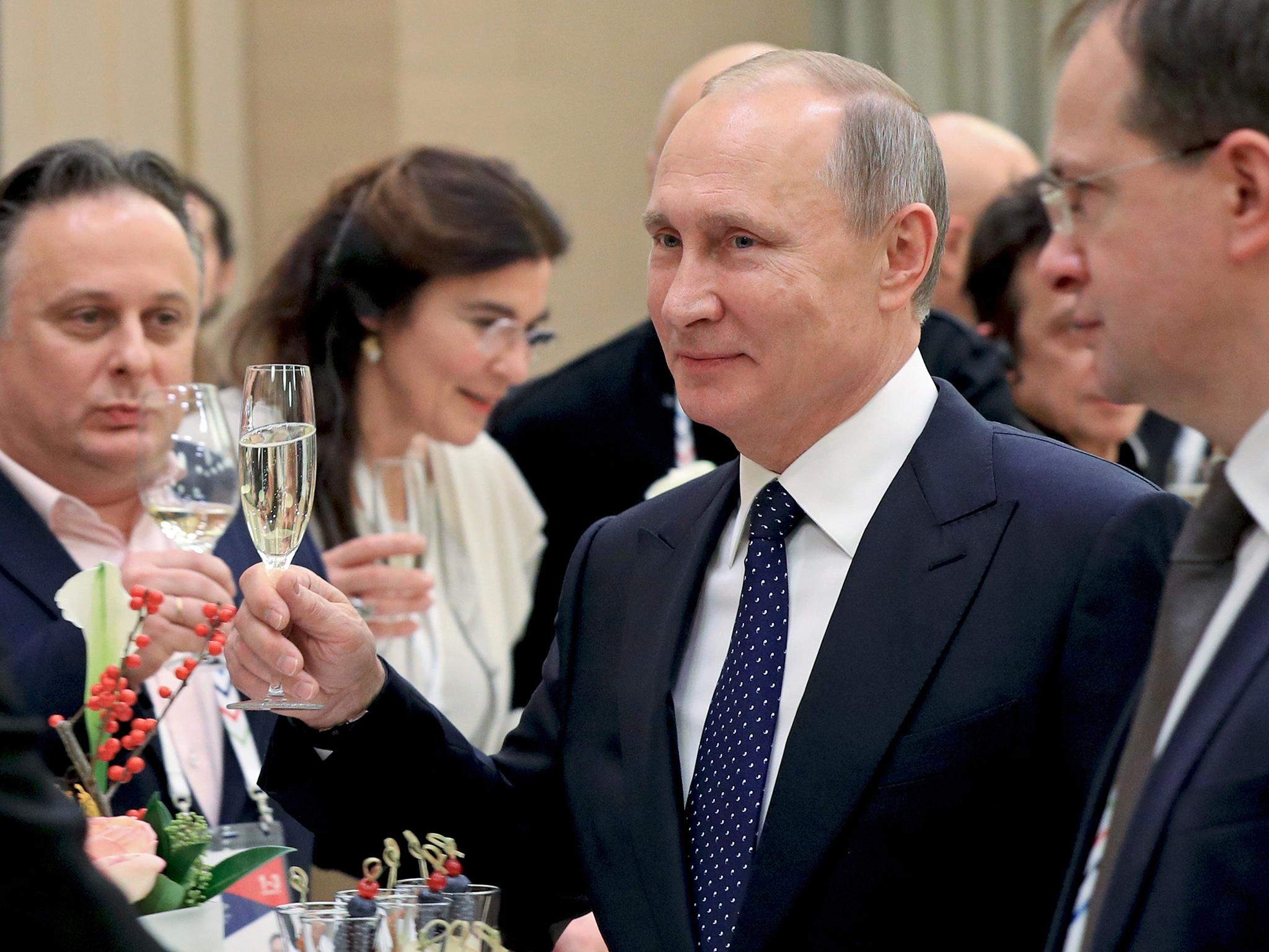 Russian President Vladimir Putin, pictured at a theatre this month, allegedly had personal ties to the hacking operation