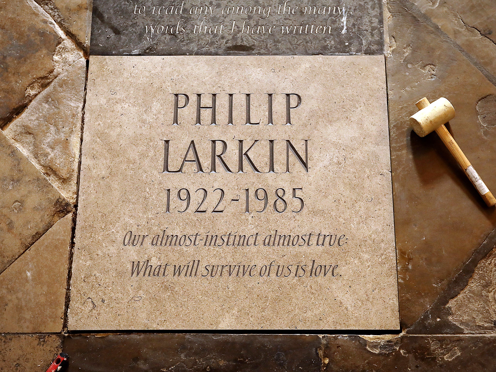 A memorial stone for English poet Philip Larkin is laid in Poet's Corner at Westminster Abbey