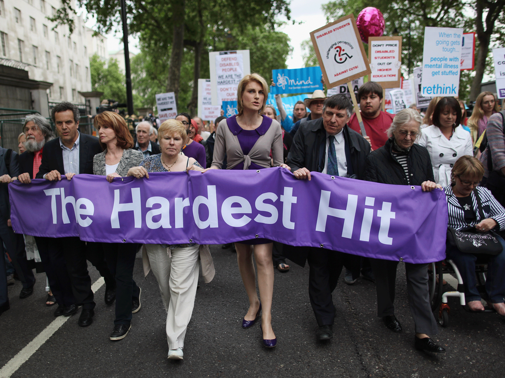 Campaigners take part in a protest to highlight cuts to disabled benefits