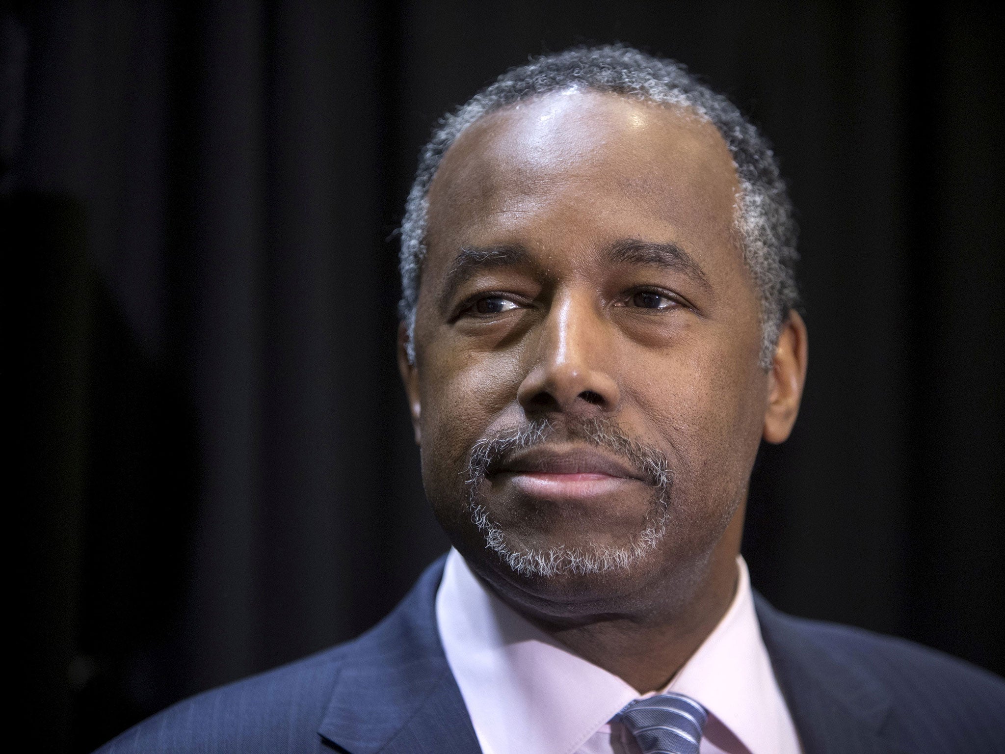 Ben Carson listens to a question from a reporter during a campaign stop in Las Vegas, Nevada