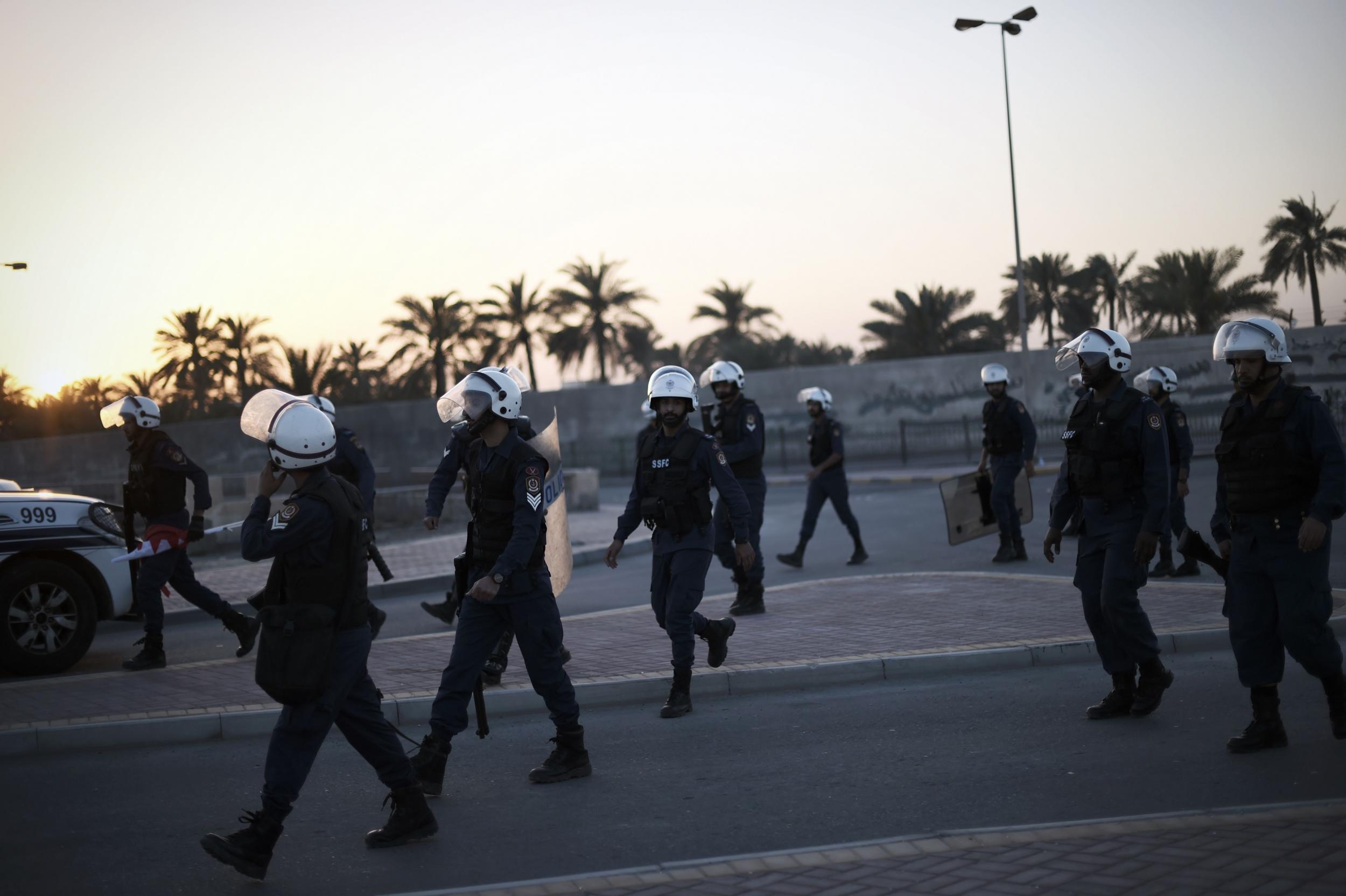 Bahraini police after dispersing protesters earlier this year