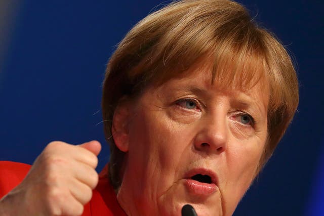 German Chancellor Angela Merkel addresses the CDU party convention in Essen, Germany, on 6 December