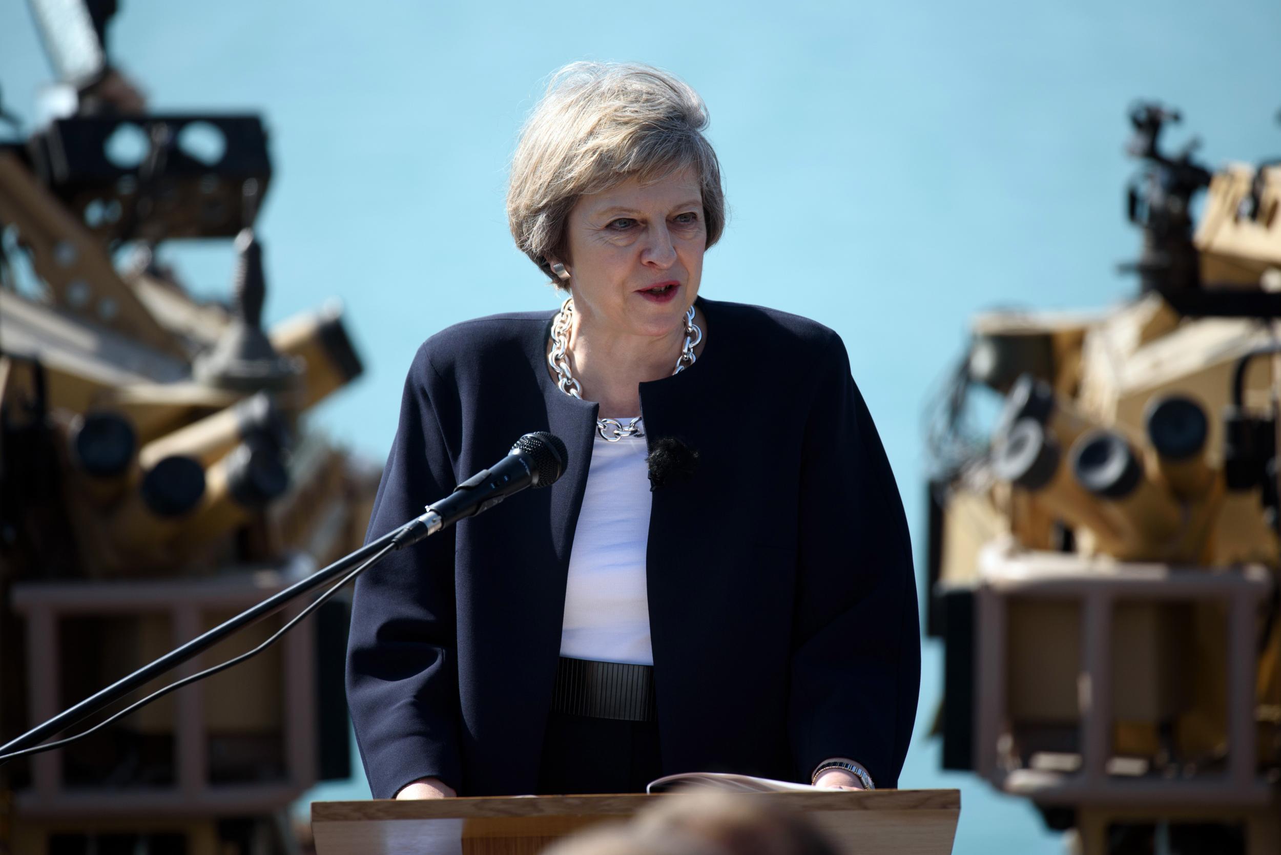 Theresa May addresses sailors on board HMS Ocean during her trip to attend the Gulf Cooperation Council summit in Bahrain