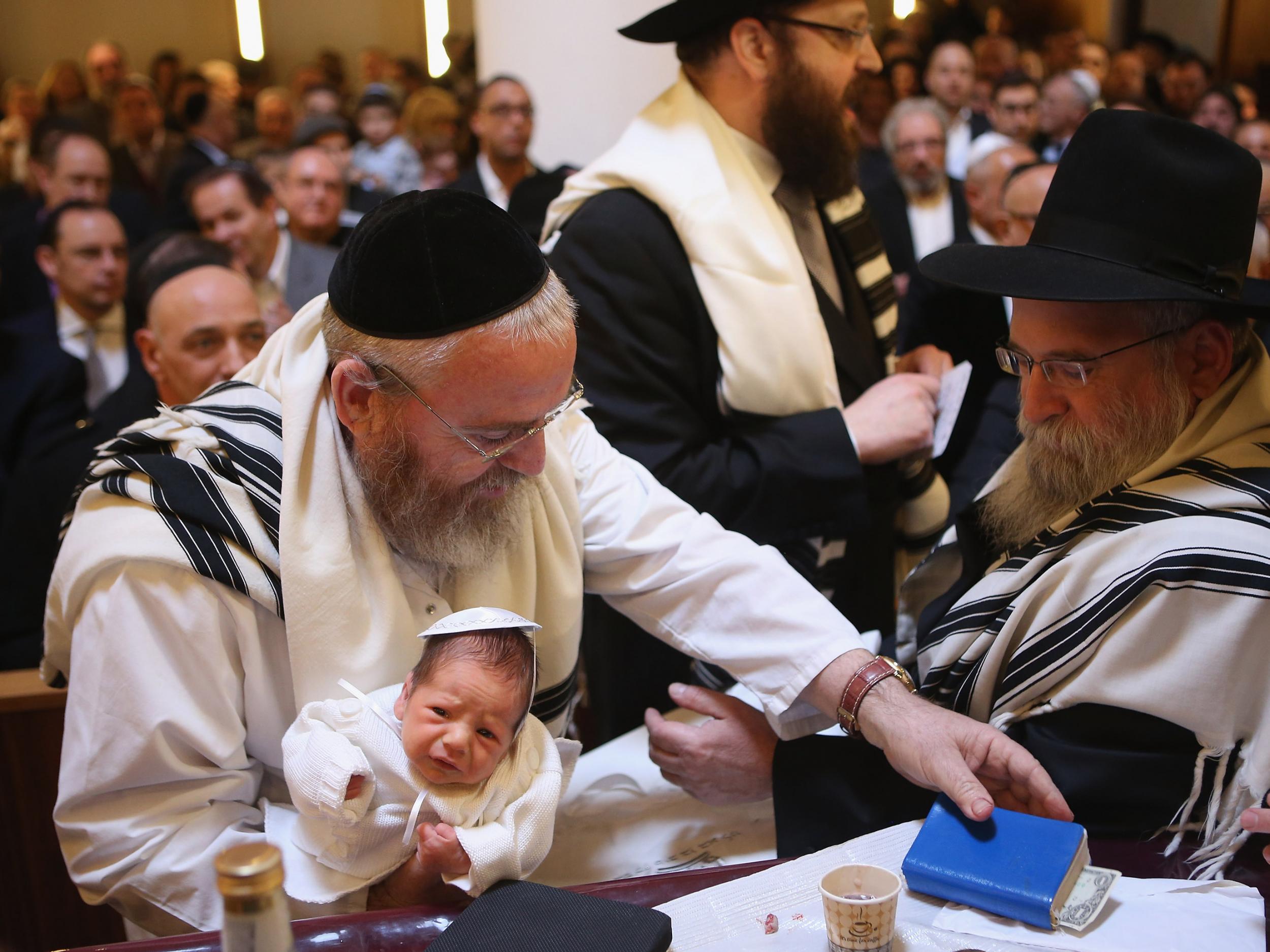 The circumcision ceremony of a baby at an Orthodox Jewish synagogue in Berlin, Germany. In 2013, a Cologne court sparked outrage among the country's Jewish and Muslim population by questioning the legality of the practice