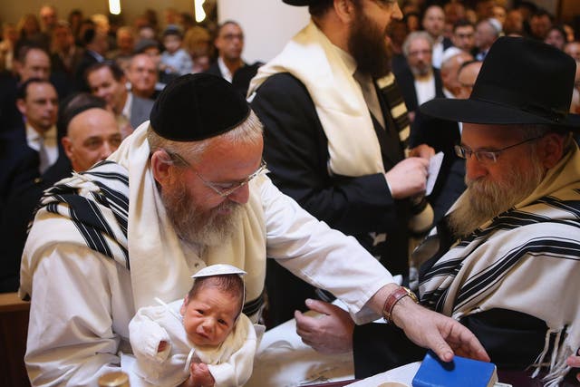 The circumcision ceremony of a baby at an Orthodox Jewish synagogue in Berlin, Germany. In 2013, a Cologne court sparked outrage among the country's Jewish and Muslim population by questioning the legality of the practice