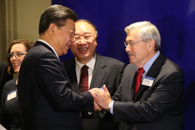 Mr Branstad greets Chinese president Xi Jinping in 2015