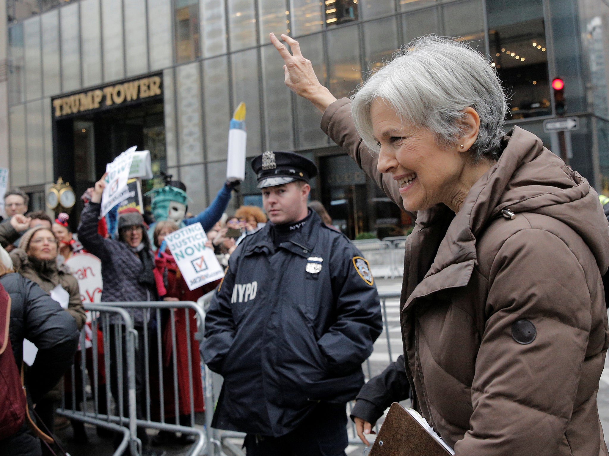 Green Party presidential nominee Jill Stein waves to supporters as she leaves a news conference outside Trump Tower in Manhattan, New York City
