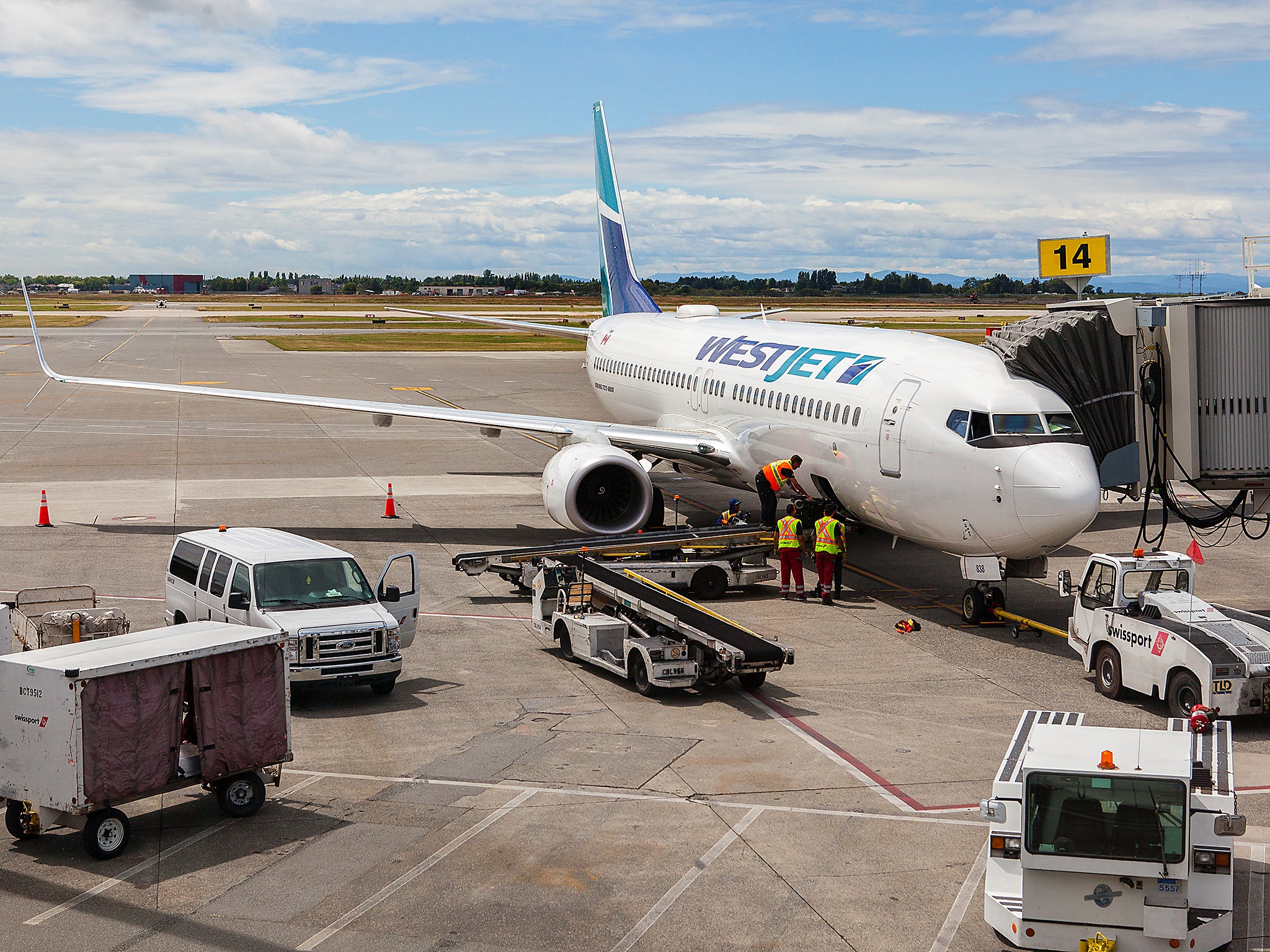 A Westjet flight waiting at Vancouver Airport