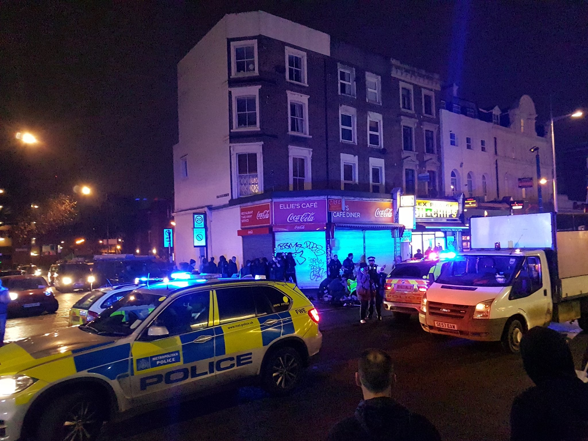 Police descended on Kilburn High Road after the shooting