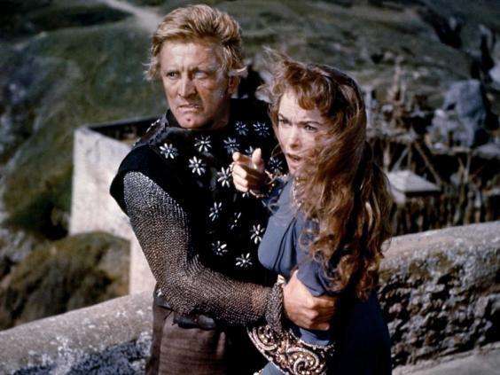 A one-eyed Kirk Douglas gets his hands on Janet Leigh in The Vikings (1958)