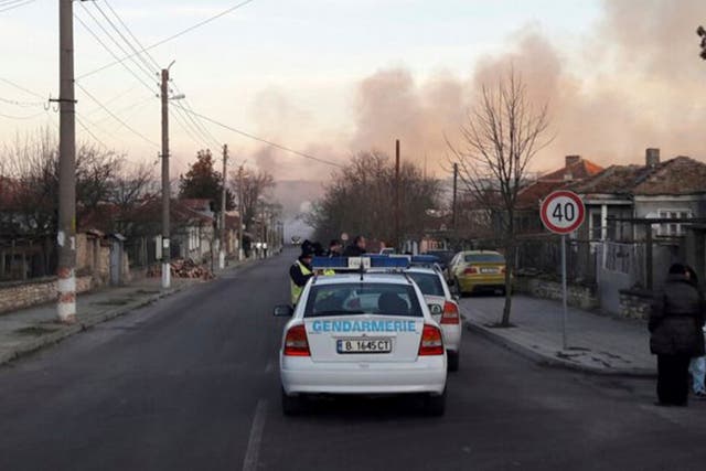 Smoke rises after a cargo train derailed and exploded in the village of Hitrino, Bulgaria