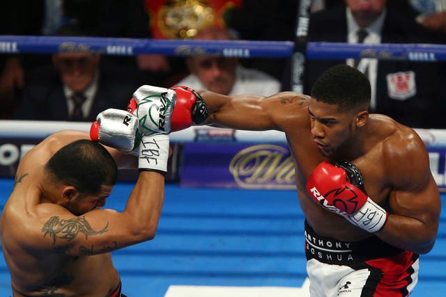 Anthony Joshua throws a punch at opponent Eric Molina
