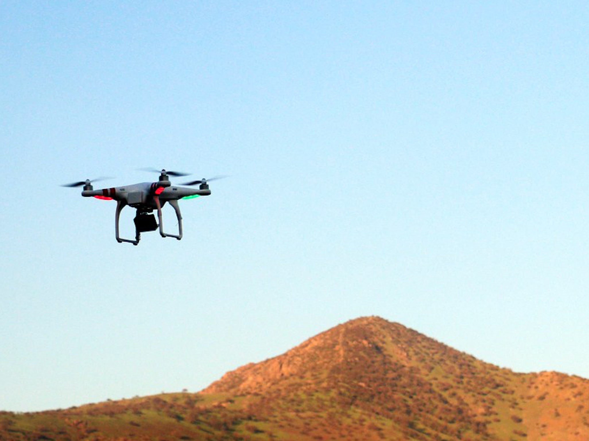 A drone flies in a park of Santiago