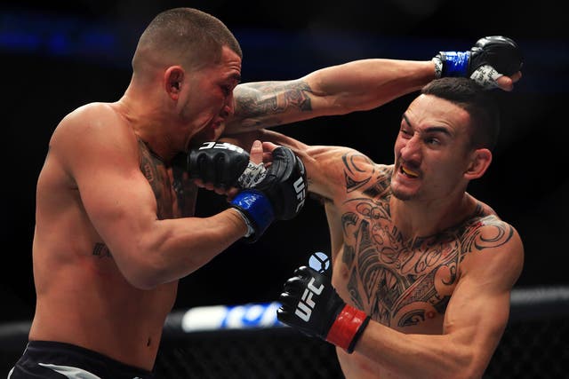 Holloway, right, claimed victory by technical knock-out