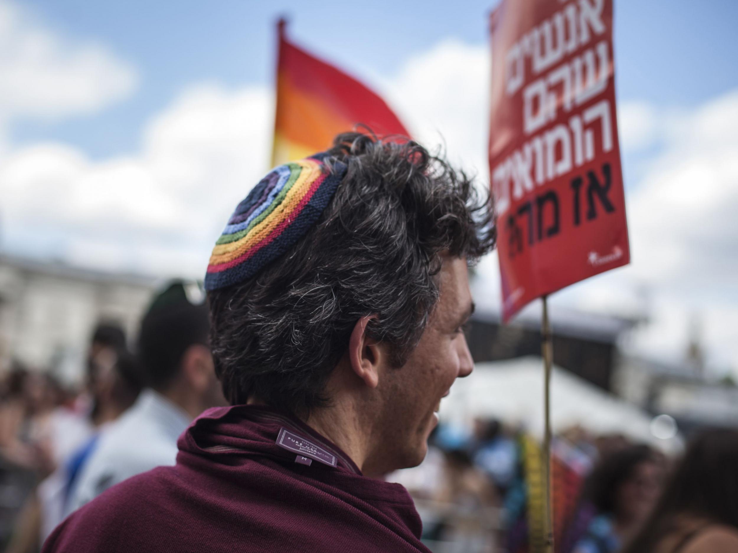 A man wearing a kippah takes part in the annual Pride parade in London