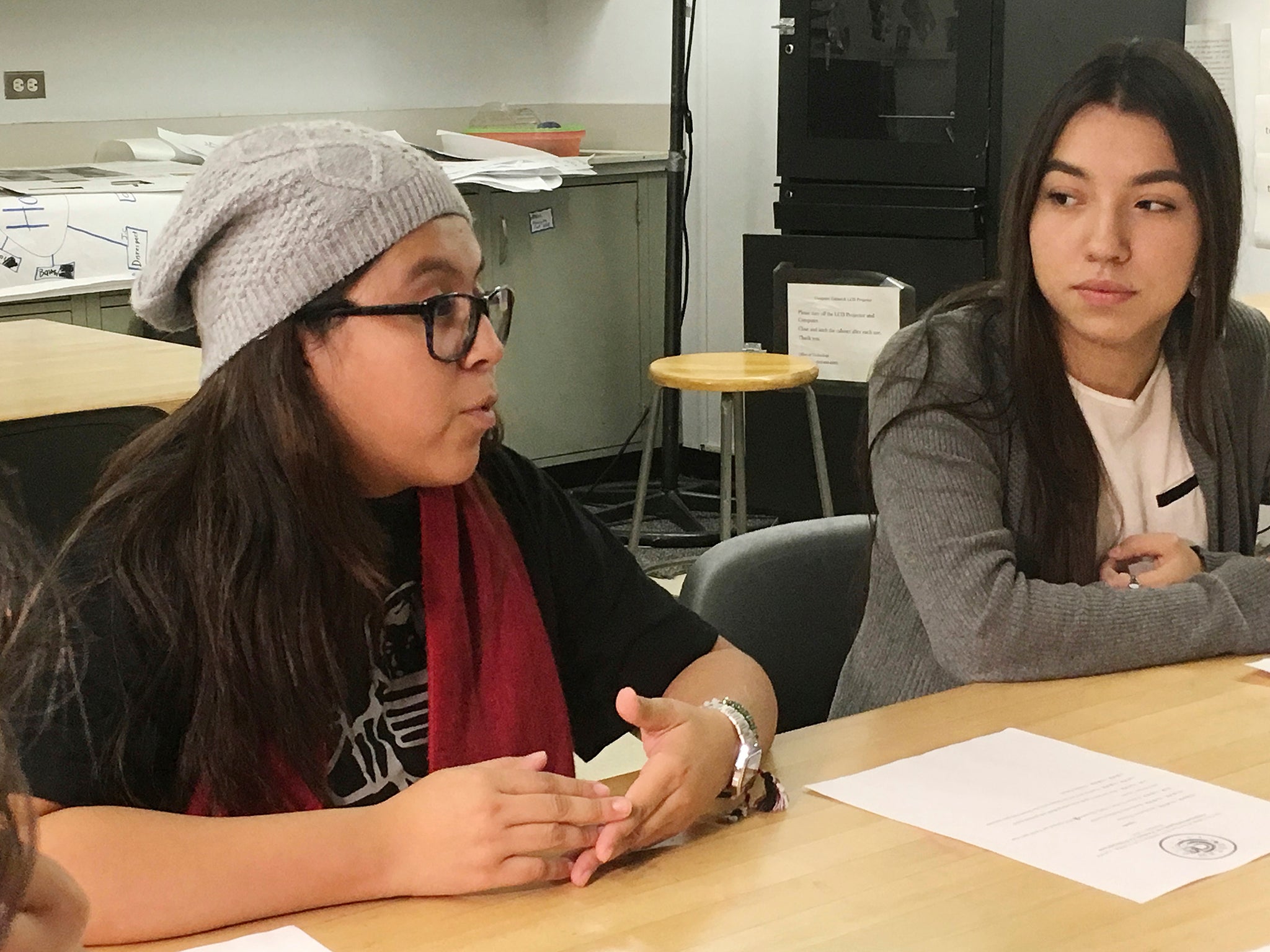 Mexican students Yatziri Tovar, left, and Roxanna Herrera, discuss their travel plans at City College of New York