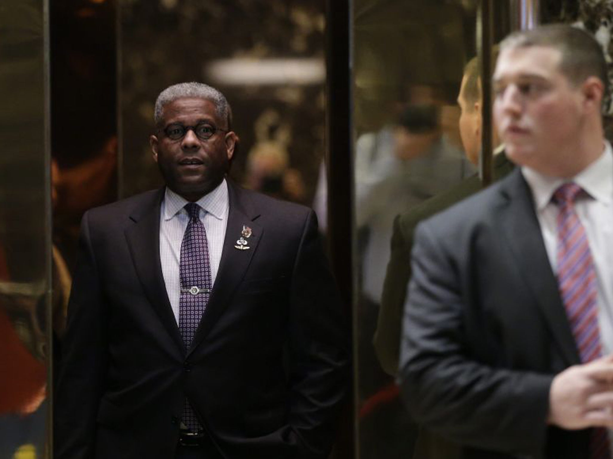 Former US Representative Allen West stands in an elevator as he arrives at Trump Tower in New York City