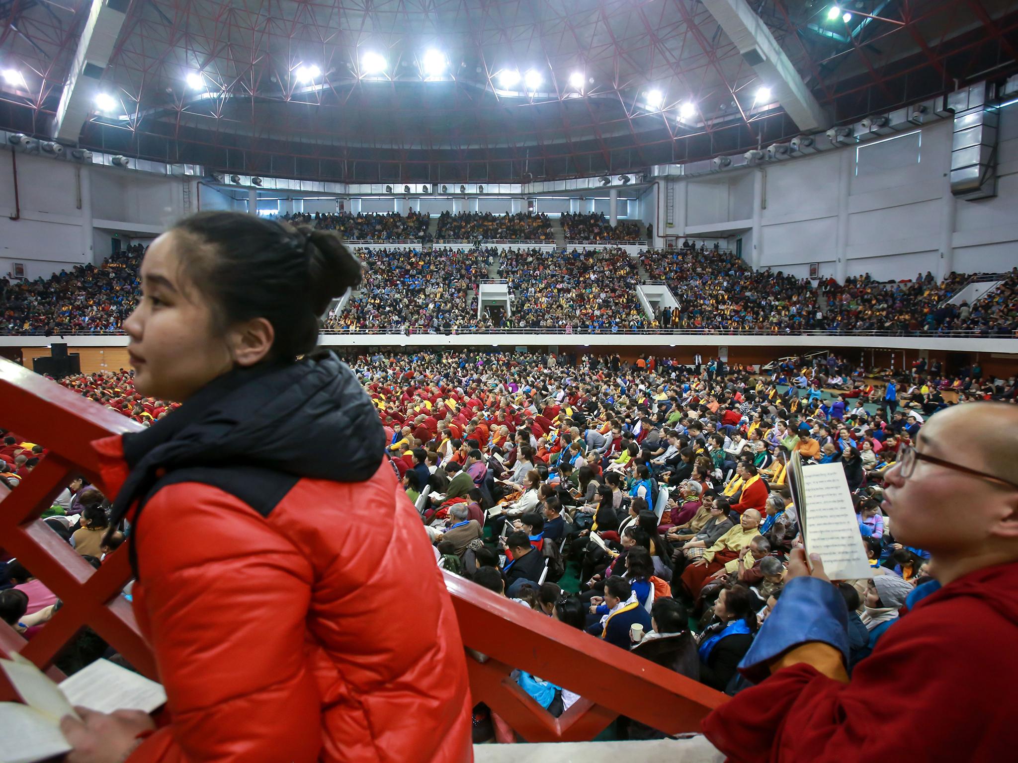 People crowd the Buyant Ukhaa sports stadium as they listen to the Dalai Lama speak in Ulaanbaatar