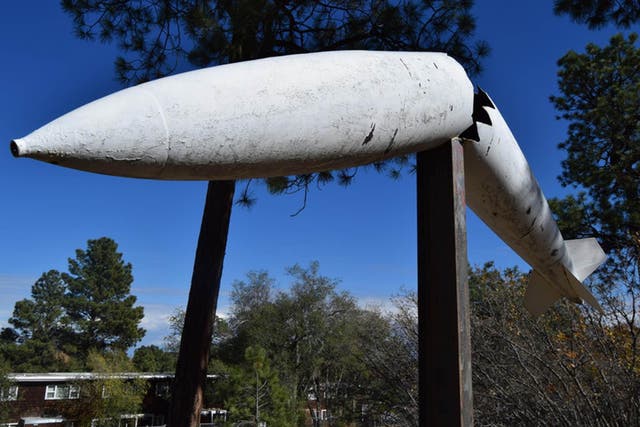 A sculpture of a bomb remains by the Black Hole of Los Alamos