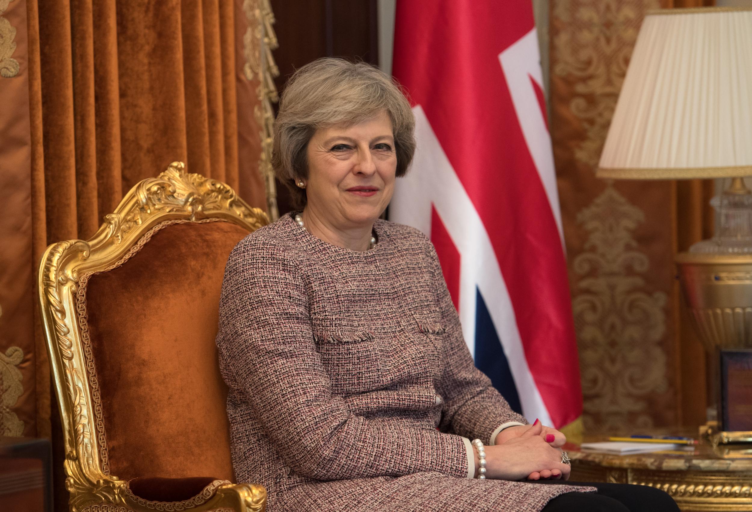 Theresa May looks on as she meets Sheikh Tamim bin Hamad Al Thani, the Emir of Qatar