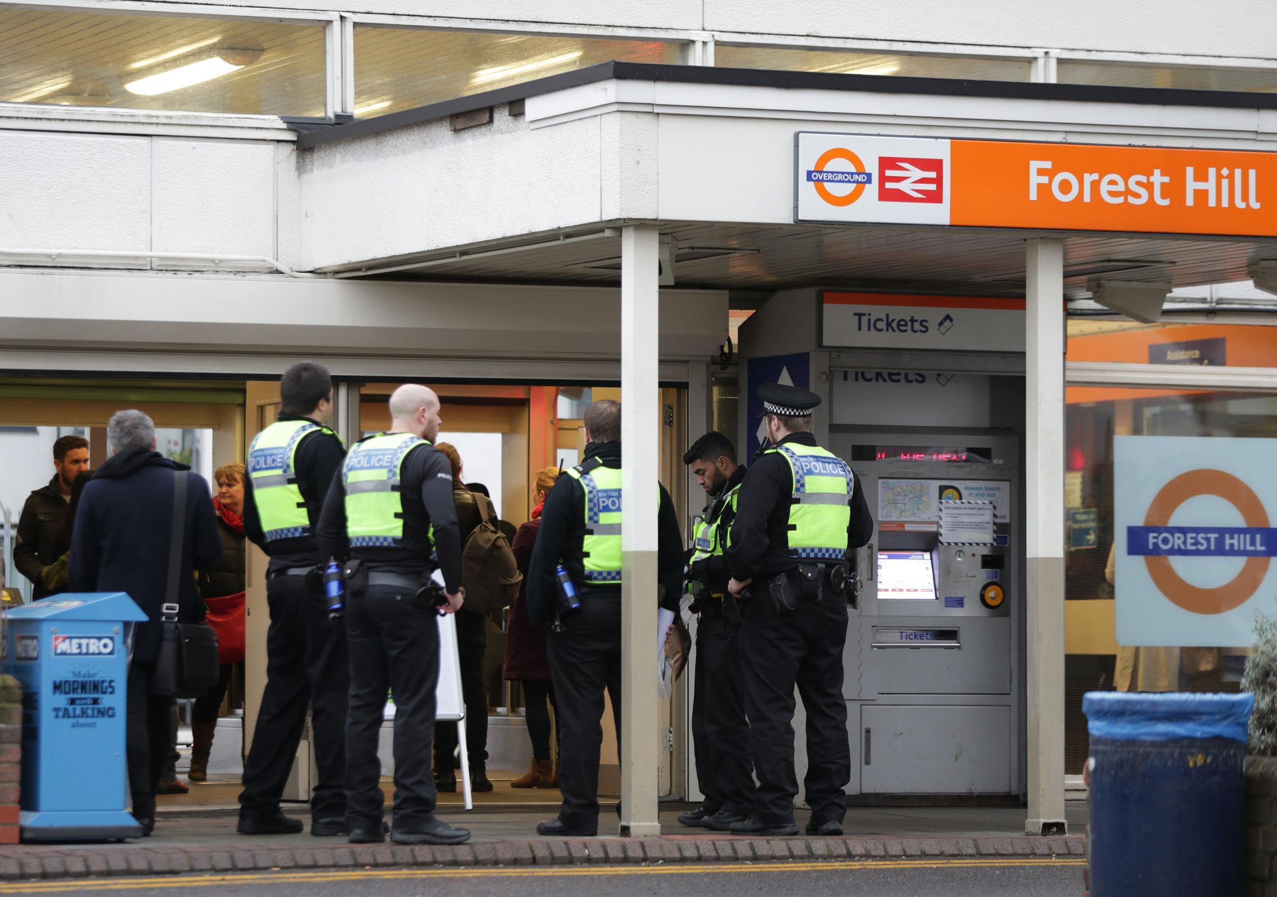 Police officers at Forest Hill train station, south-east London