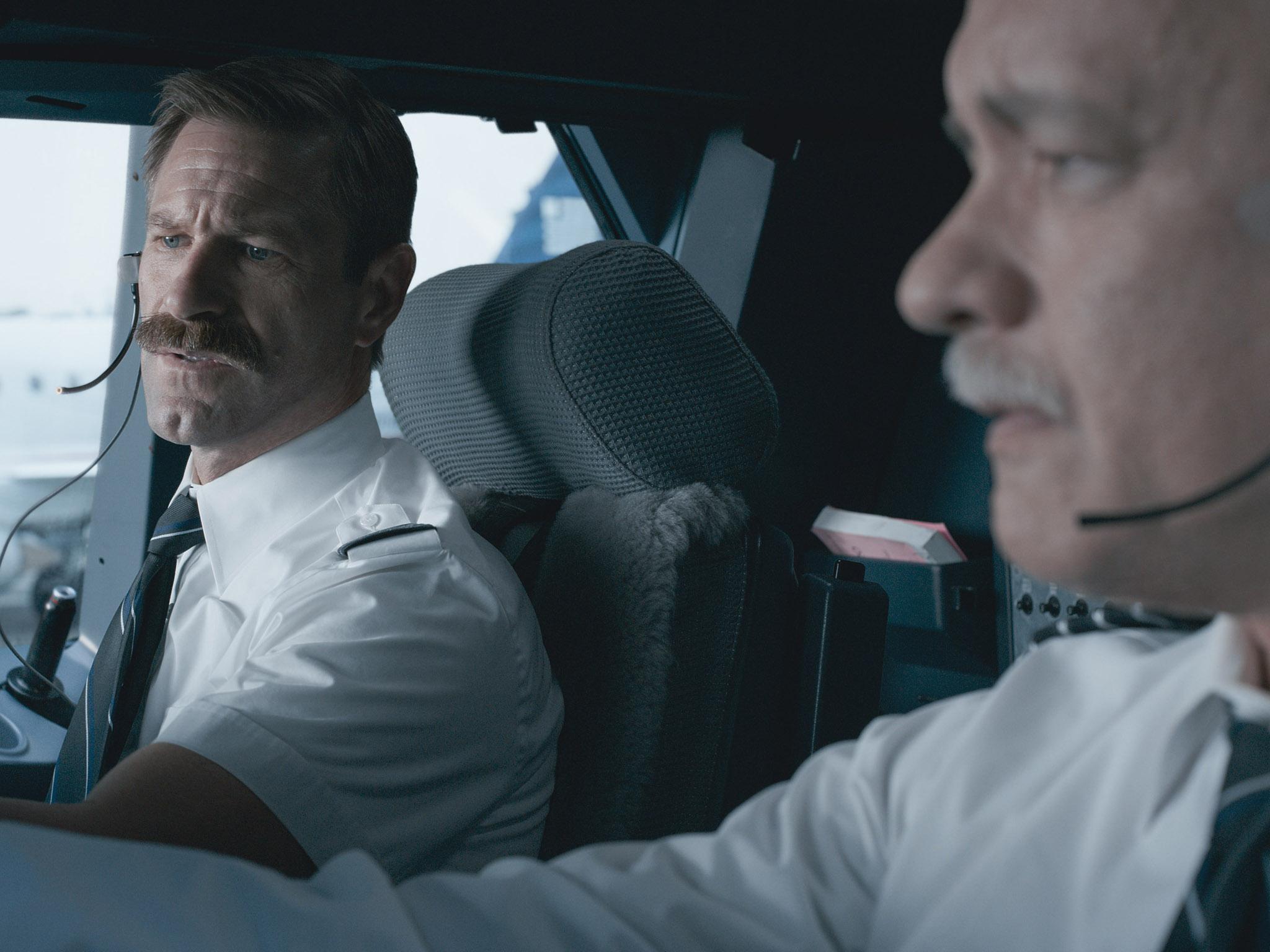 &#13;
Right-hand man: Eckhart opposite Tom Hanks in the cockpit in ‘Sully’ (Warner)&#13;