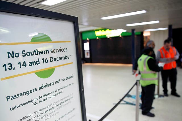 A board at London Victoria advises passengers of industrial action