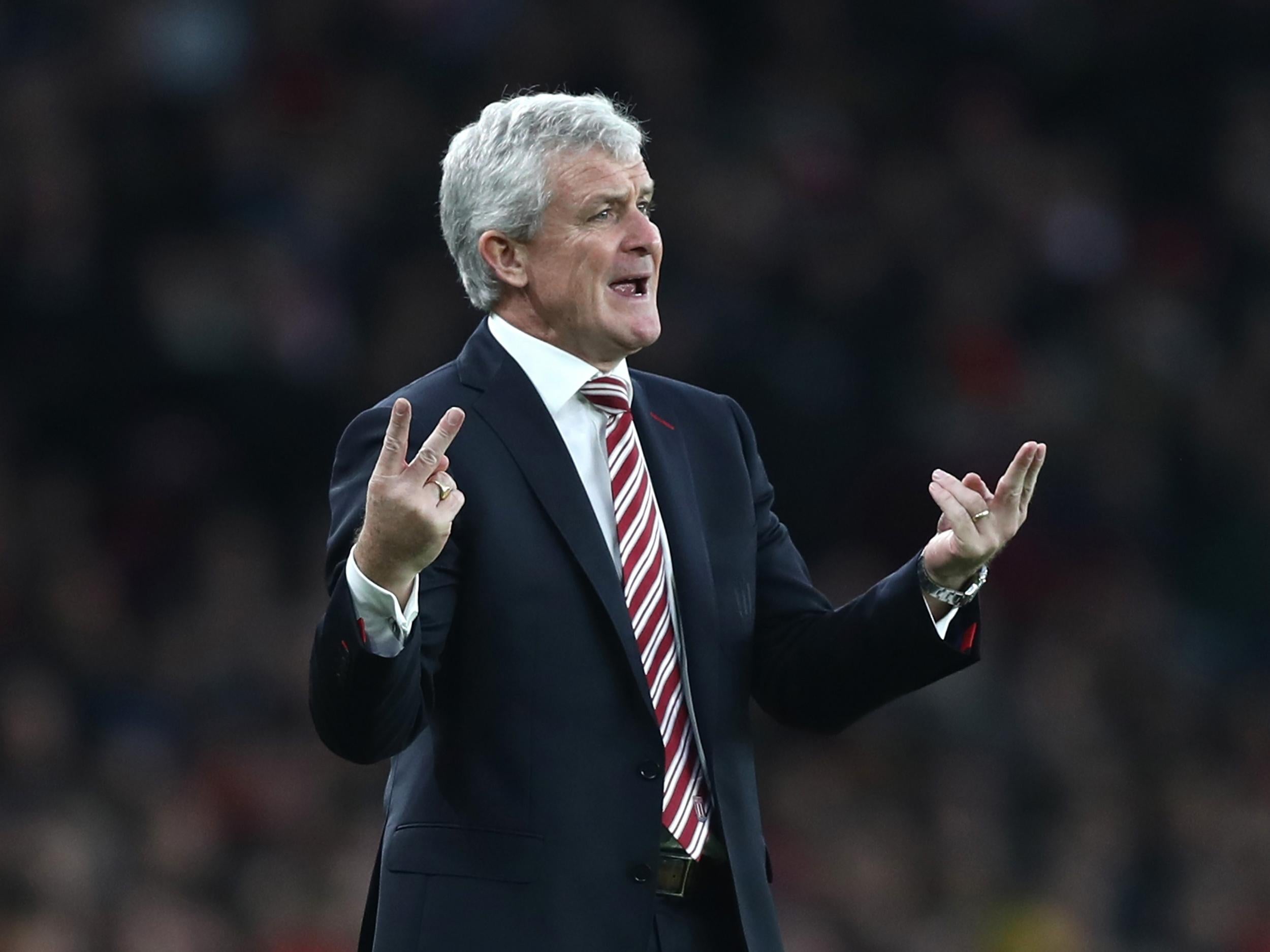 Hughes suggested Wenger could have been punished for a push on the fourth official