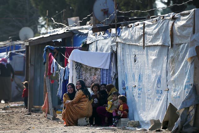 Syrian refugee women and children in a refugee camp in Lebanon, close to the Syrian border