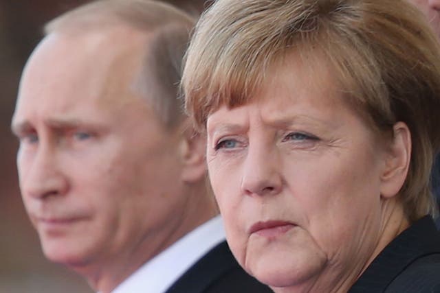 File photo of President Putin and Chancellor Angela Merkel 
