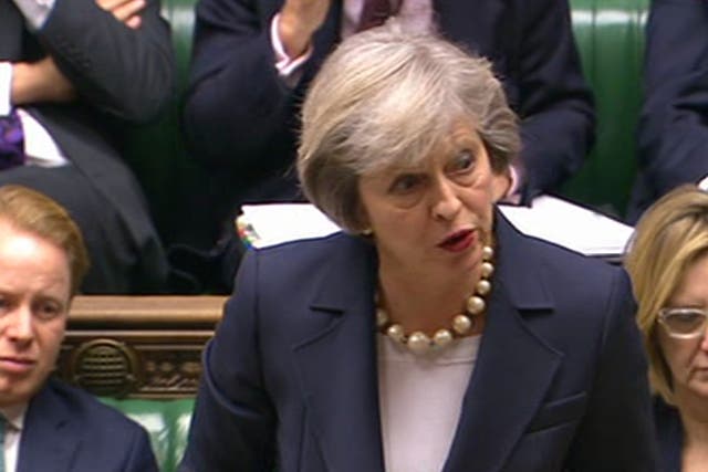 Theresa May in the House of Commons during PMQs today