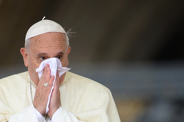 Pope Francis blows his nose during a 2013 ceremony in Rome