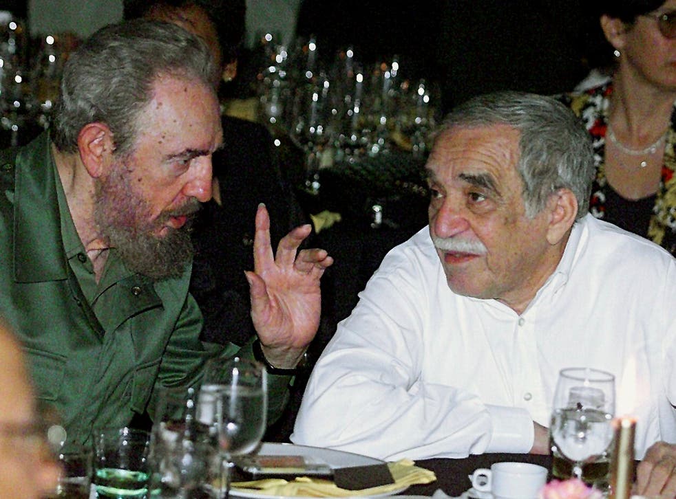Cuban President Fidel Castro talks with the Colombian Nobel Laureate of Literature, Gabriel Garcia Marquez, during dinner at the Cuban Cigars Festival in Havana in 2000