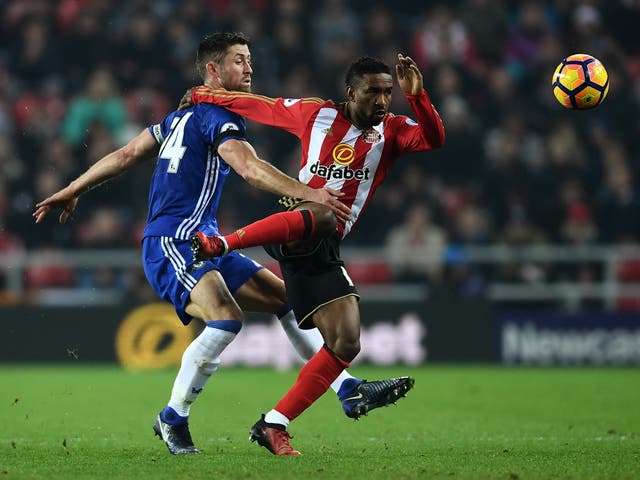 Cahill and Defoe battle for the ball at the Stadium of Light