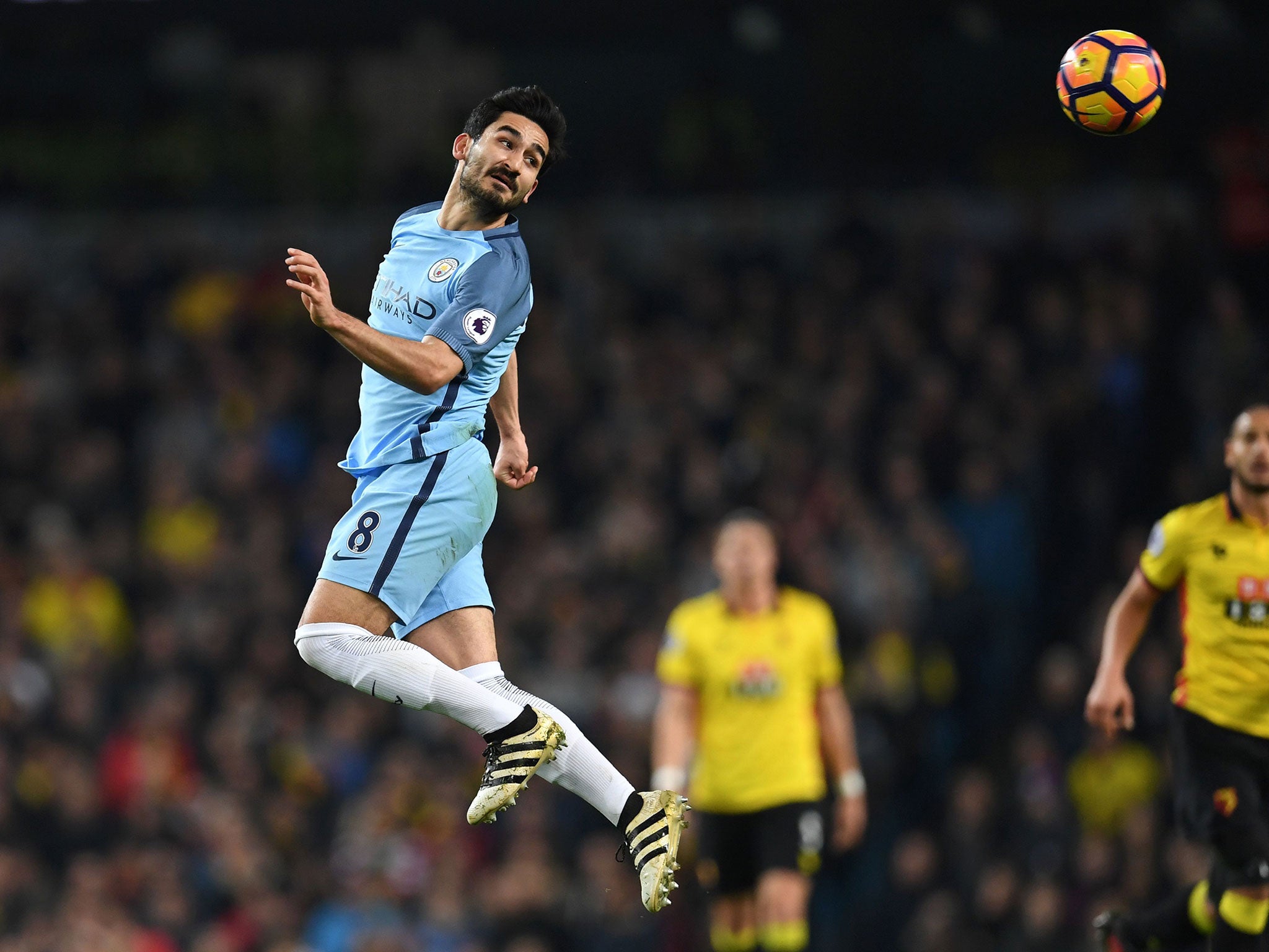 Ilkay Gundogan nods on a high ball