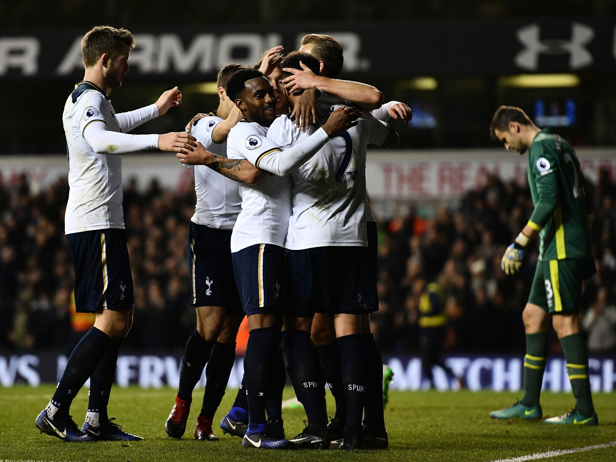 Tottenham's players celebrate with Eriksen after the player scored his second