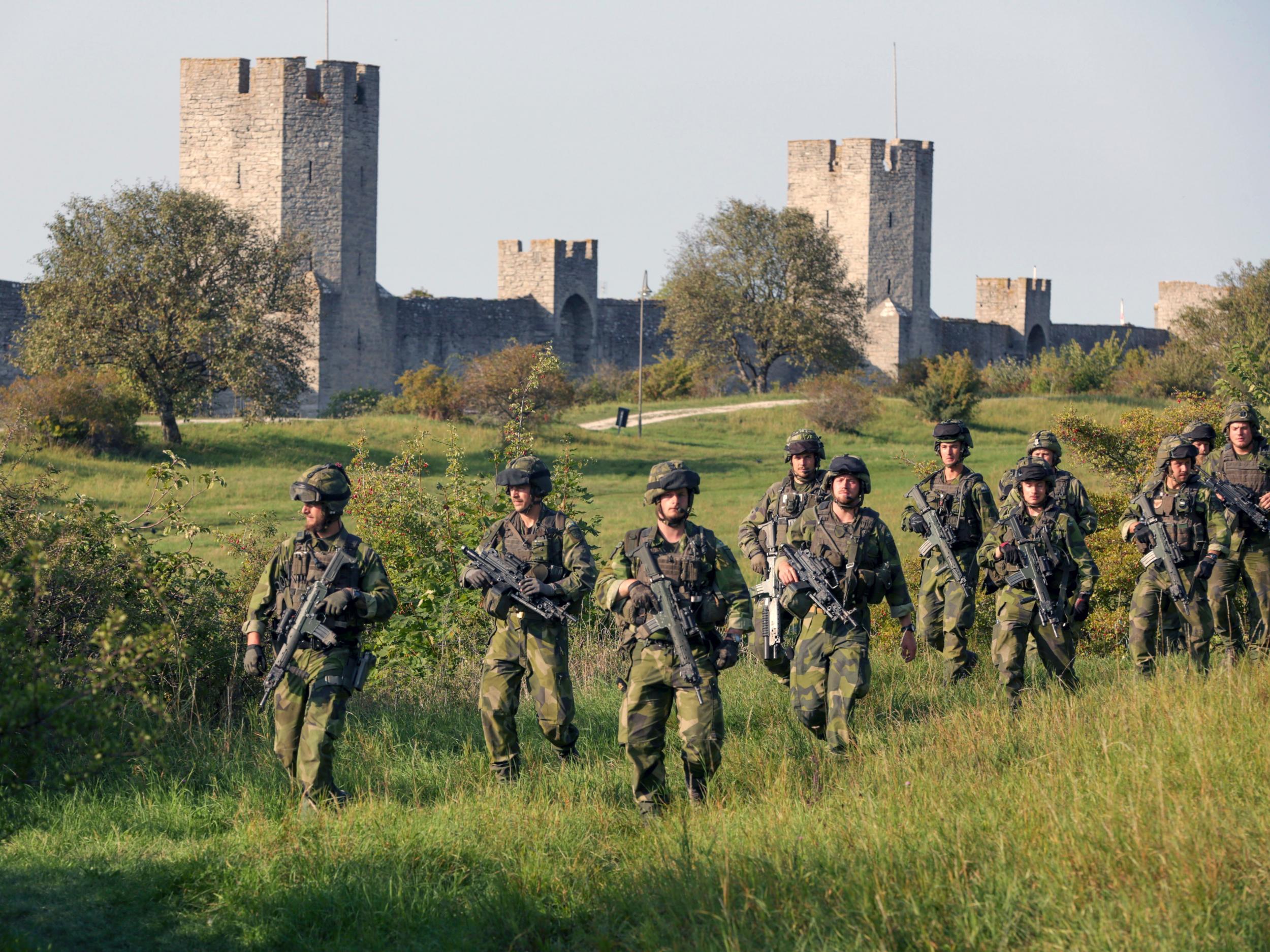 Swedish troops patrol outside Visby, on Gotland island, Sweden